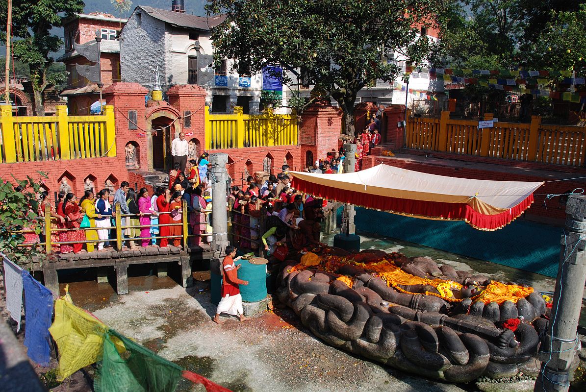 Kathmandu Valley 1 Budhanikantha 4 Pilgrims Near Sleeping Vishnu Statue Hindu pilgrims line up to watch the Hindu priests perform a ceremony around 9am at Budhanilkantha Narayan (Sleeping Vishnu).